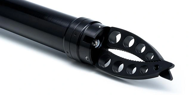 Original close-up of the aluminium gripper jaws, teeth, jaw pivots and forward actuator body