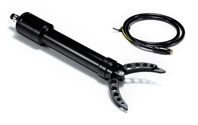 Original 2-DOF subsea gripper with jaws open and the mating cable beside the housing