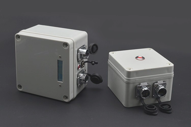 Battery-powered and USB-powered AQUROV PLC tether interface boxes on a grey background